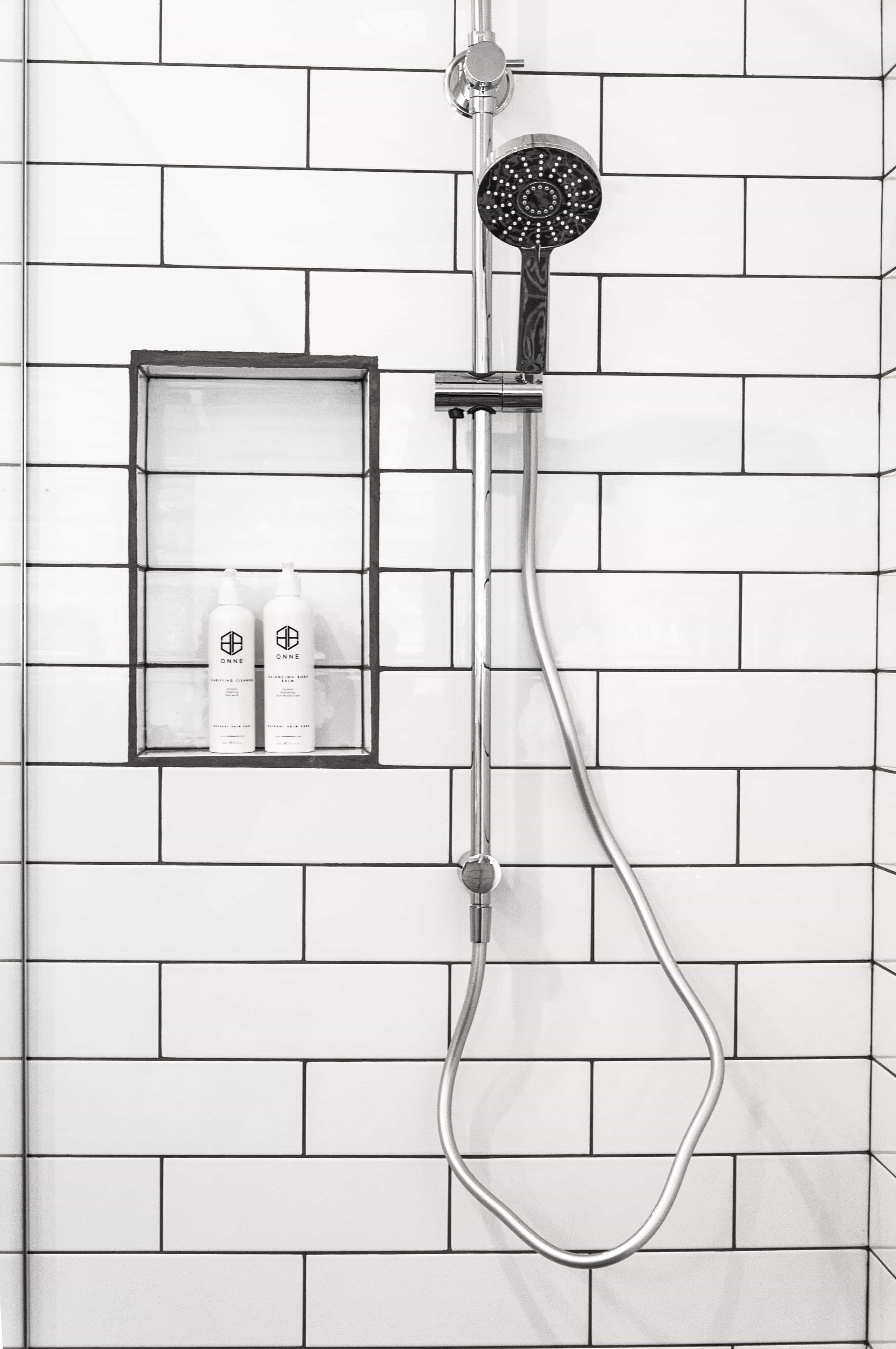 Fresh shower tiles and a modern shower head